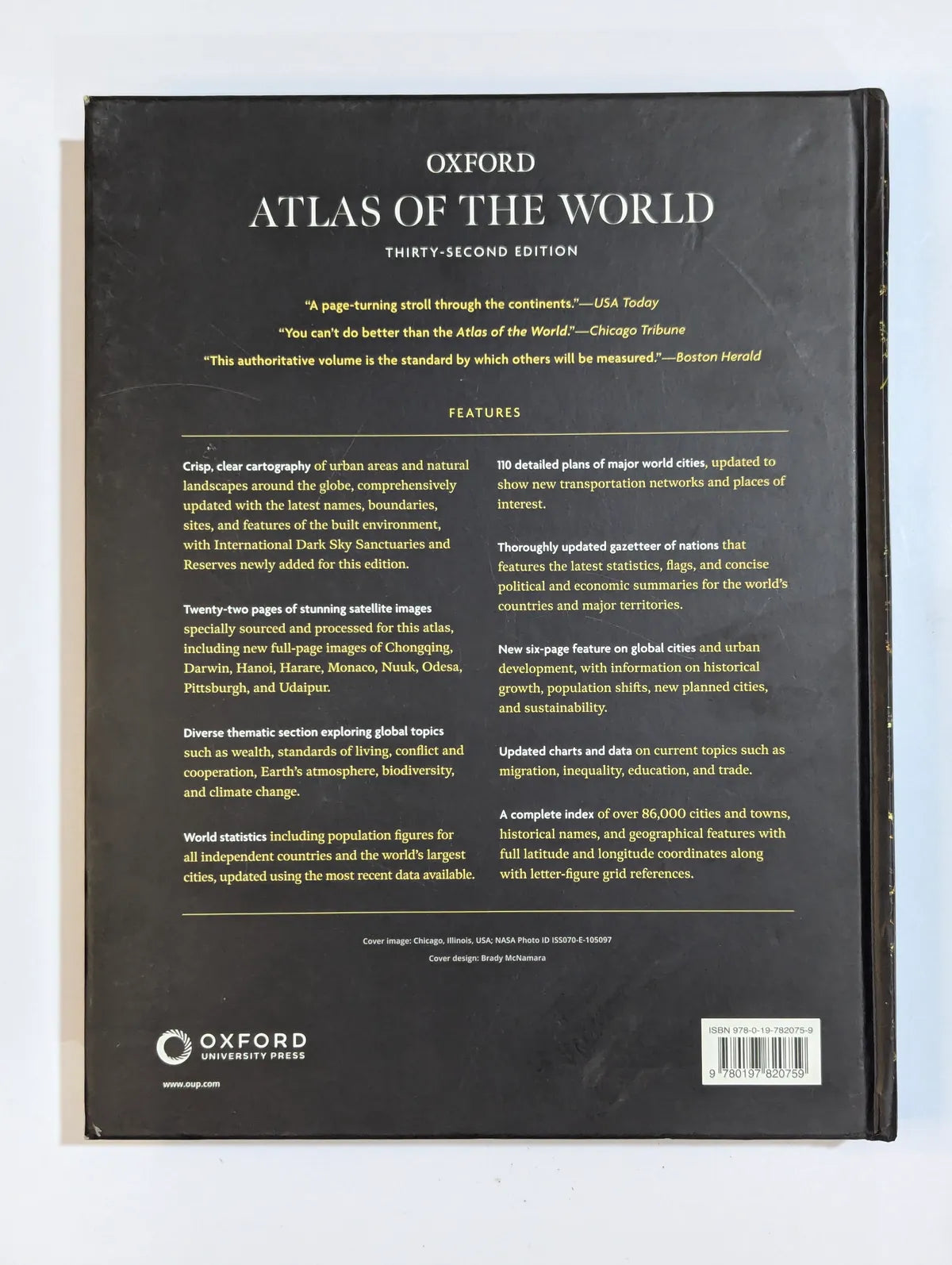 Back cover of the Oxford Atlas of the World on a white background