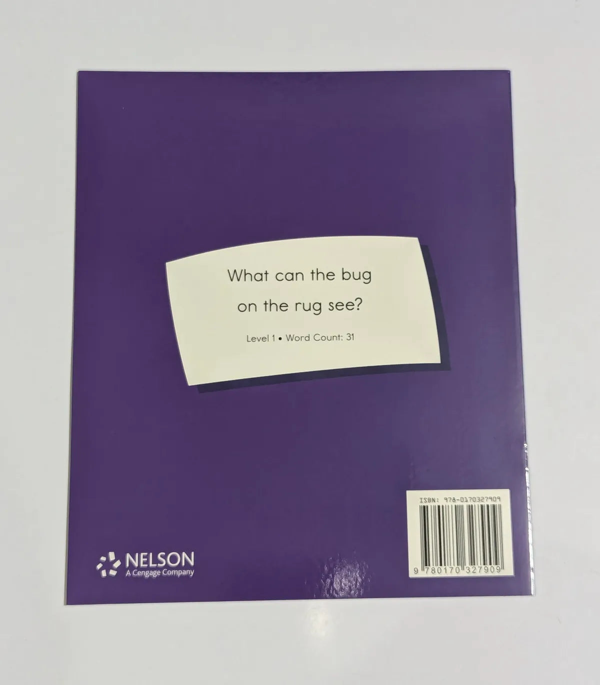 Purple book cover with a white label containing text and Nelson logo.