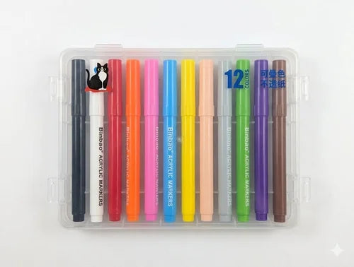 Set of 12 colorful acrylic markers in a clear plastic case on a white background