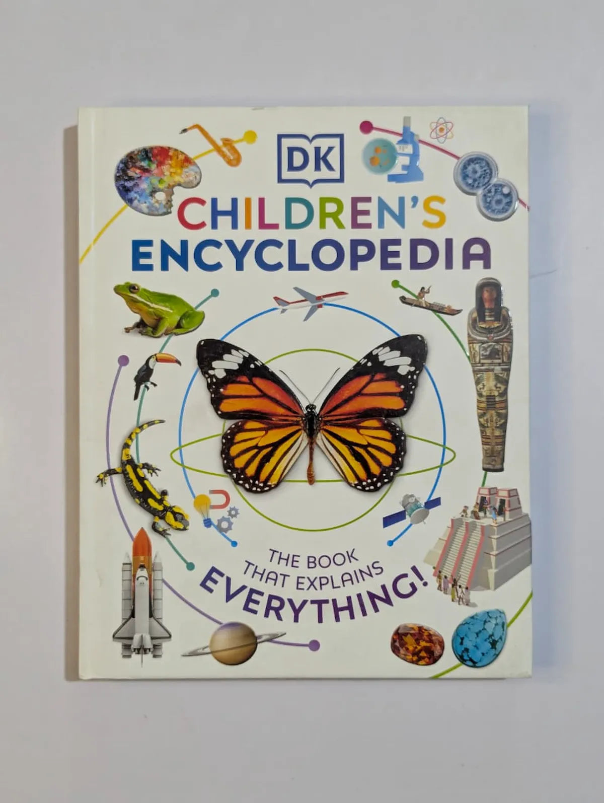 Children's Encyclopedia book with colorful illustrations on a white background