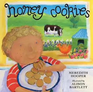 Book cover of 'Honey Cookies' with a child holding cookies and a cow in the background