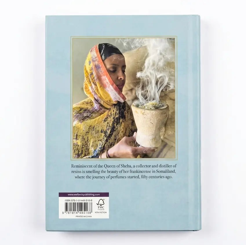 Product packaging with a woman in traditional attire and a smoking plant, on a light blue background.