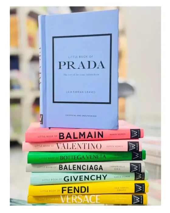 Stack of books with brand names on a blurred background