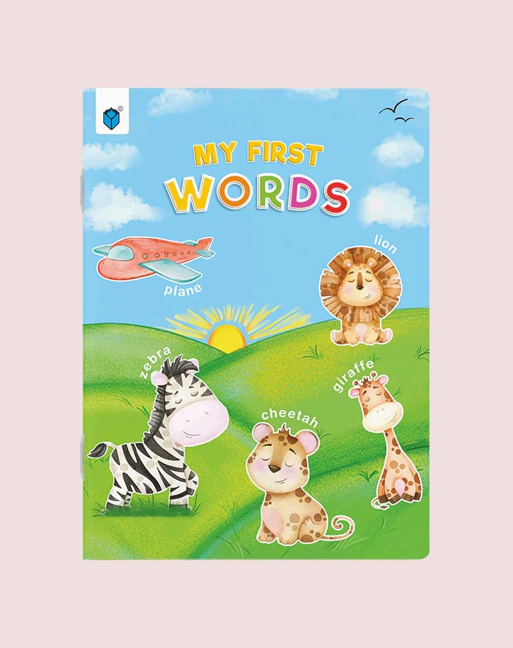 Children's book titled 'My First Words' with animal illustrations on a blue sky and green field background.