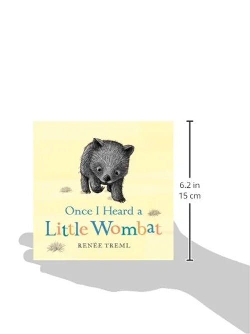 Book titled 'Once I Heard a Little Wombat' held in a hand with dimensions indicated.