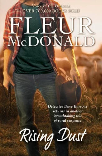 Book cover of 'Rising Dust' by Fleur McDonald with a person holding a hat in a field.