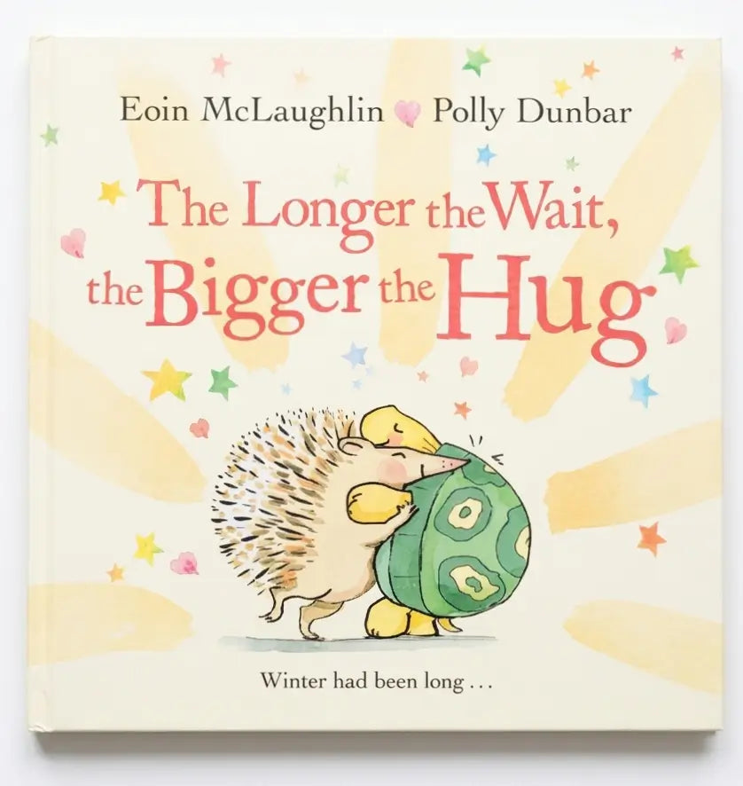 Book cover of 'The Longer the Wait, the Bigger the Hug' with hedgehogs and colorful text.
