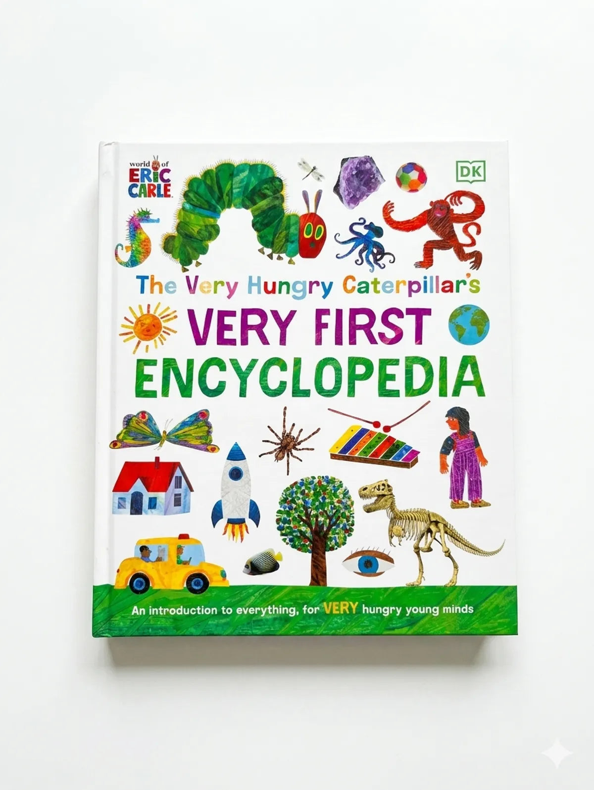 Book titled 'The Very Hungry Caterpillar's Very First Encyclopedia' by Eric Carle on a white background