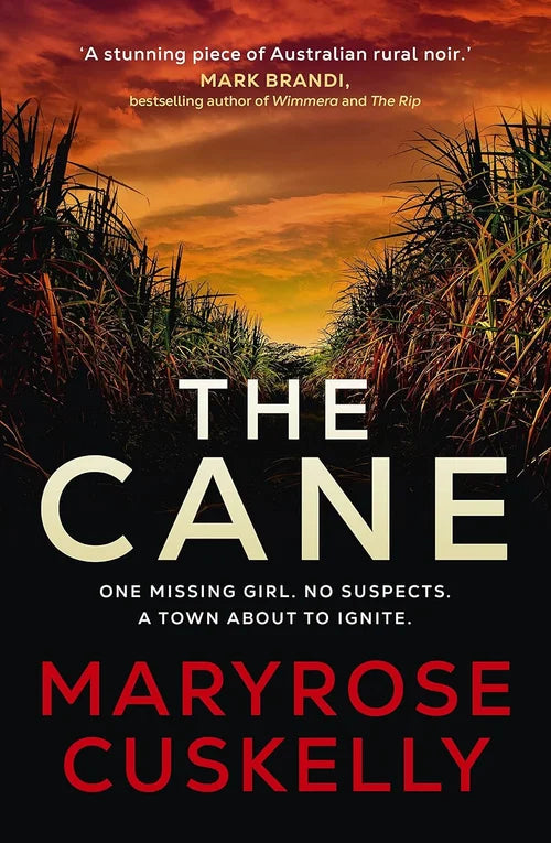 Book cover of 'The Cane' by Maryrose Cuskelly with a sunset over grasses.
