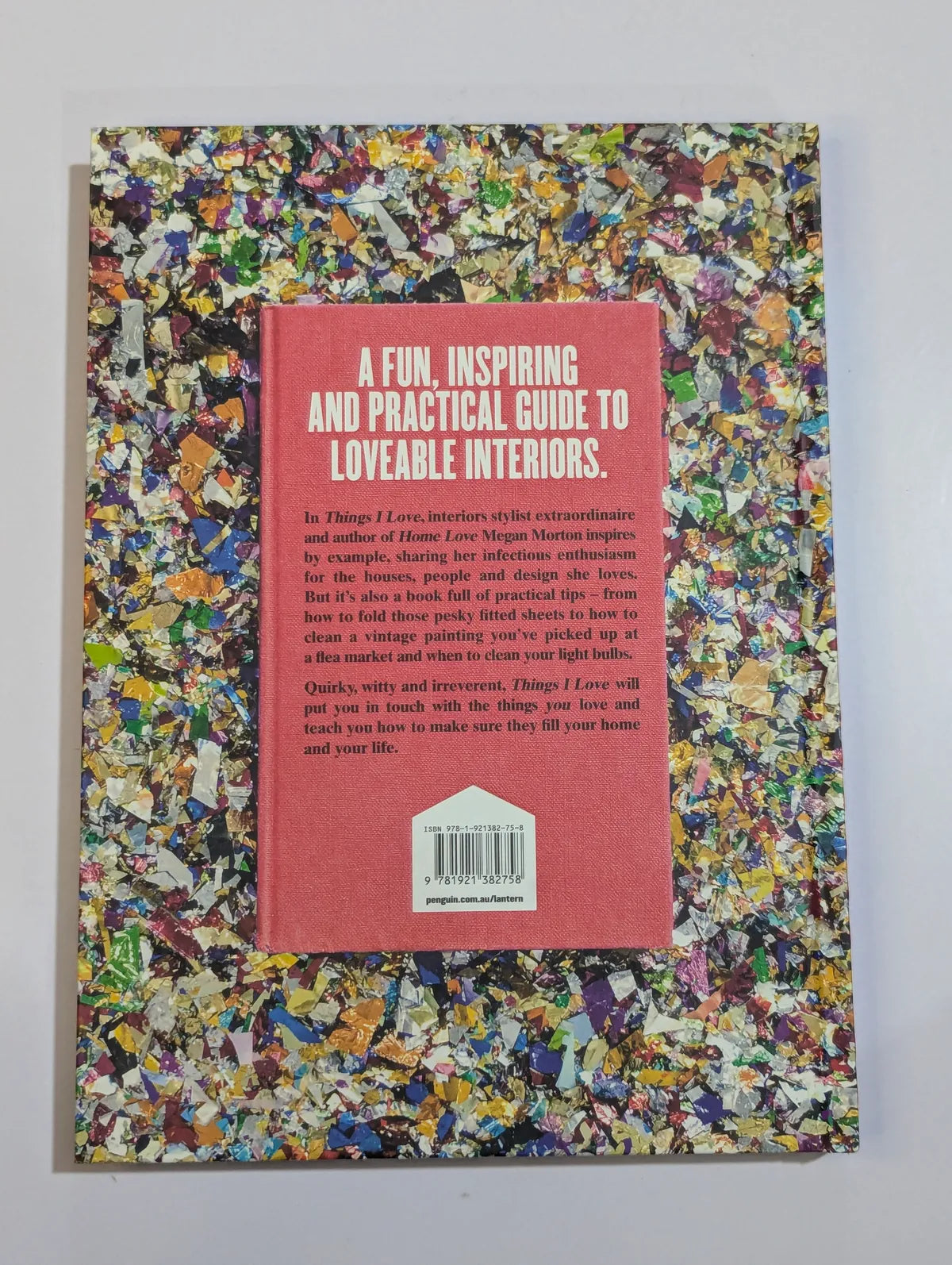Book cover with colorful textured design and pink section with text on a gray background