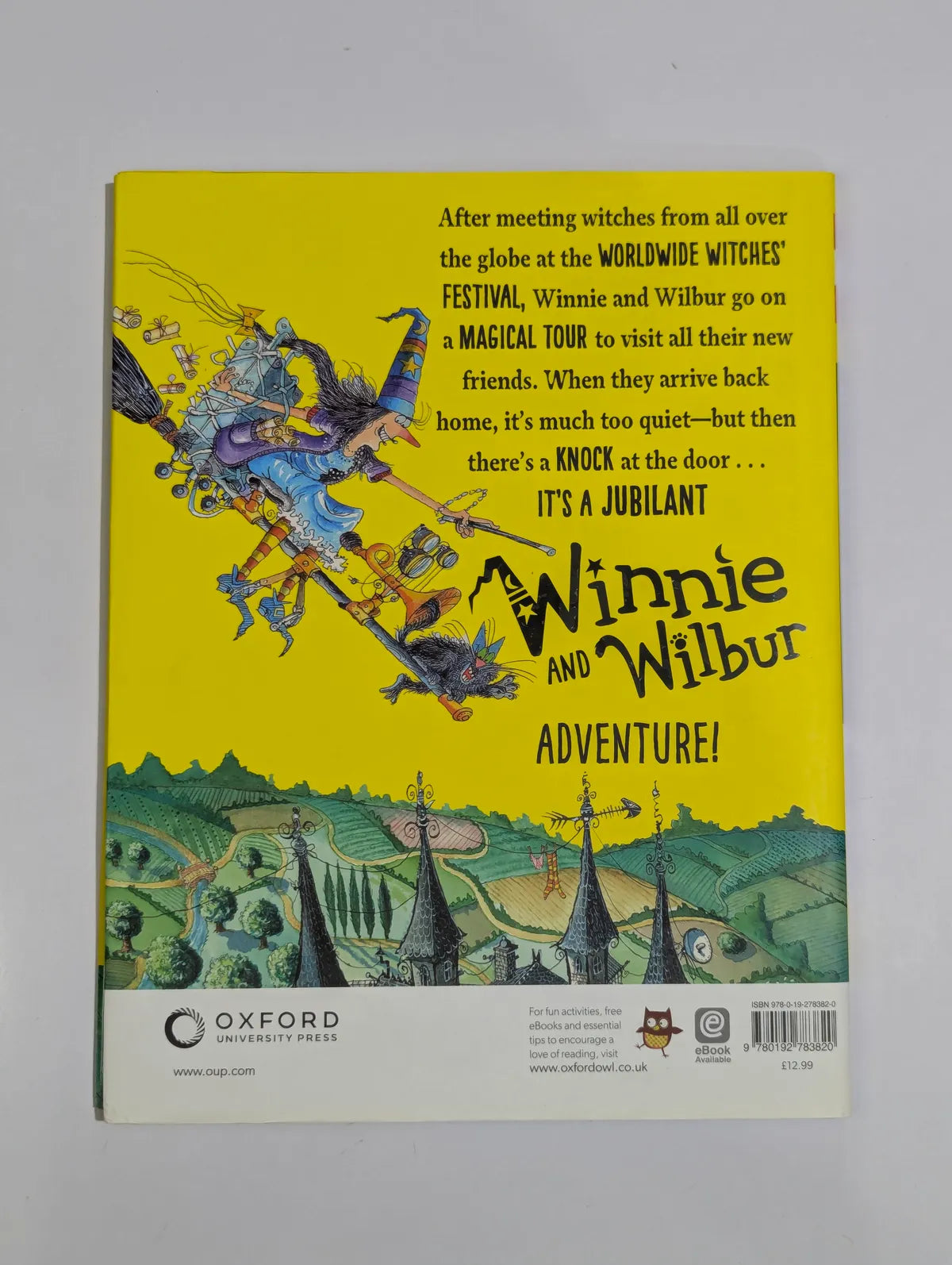 Book cover of 'Winnie and Wilbur' with colorful illustration and text on a yellow background