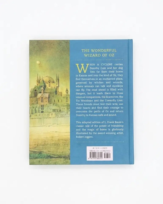 The back cover of a book titled 'The Wonderful Wizard of Oz' shown against a plain white background. The cover features a blue spine-like section with white text and a scenic illustration of a castle on the left, with a grassy field at the bottom.