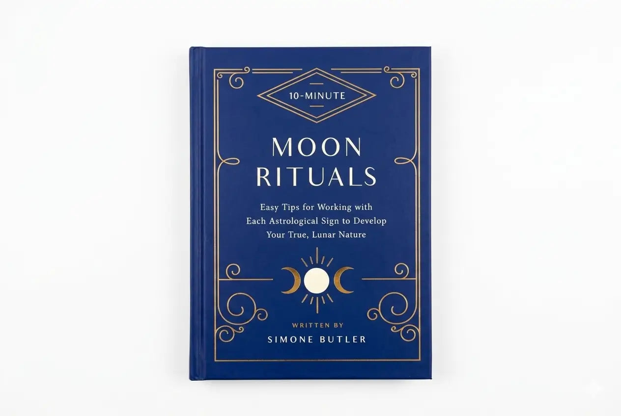 Blue book titled 'Moon Rituals' by Simone Butler on a white background