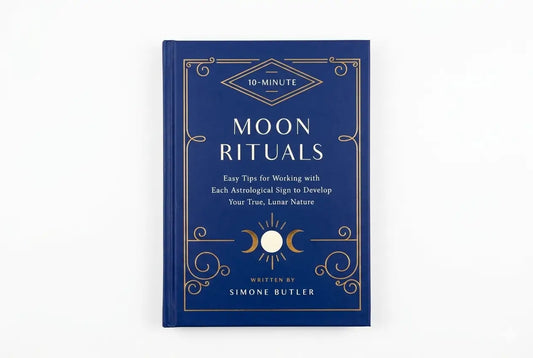 Blue book titled 'Moon Rituals' by Simone Butler on a white background