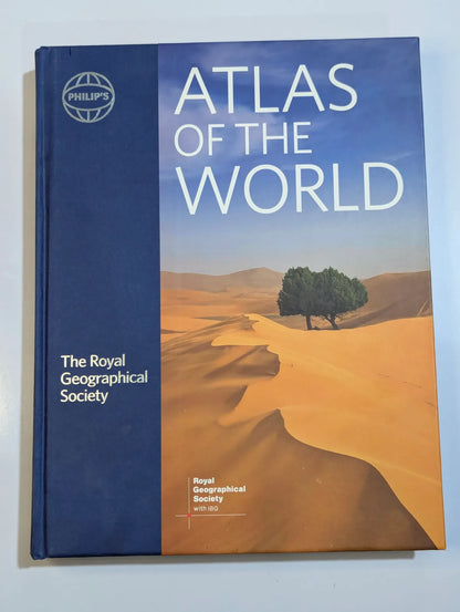 Atlas of the World by The Royal Geographical Society on a light blue background