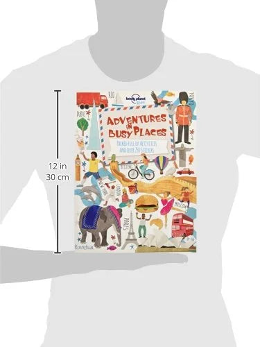 Book titled 'Adventures in Busy Places' by Lonely Planet on a white background with dimensions indicated.