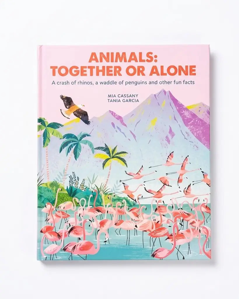 A hardcover children's book titled 'Animals: Together or Alone' by Mia Cassany and Tania Garcia, featuring a colorful cover illustration of flamingos, mountains, palm trees, and a toucan.