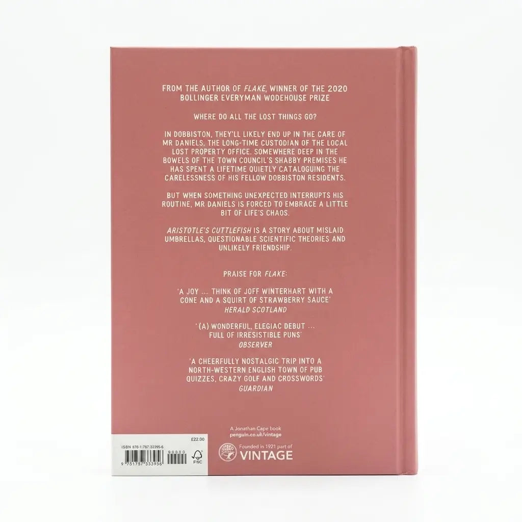 The back cover of a book, shown flat against a white background. The cover is a muted dusty rose pink with white text listing critical acclaim and publisher details, including the Vintage logo at the bottom.