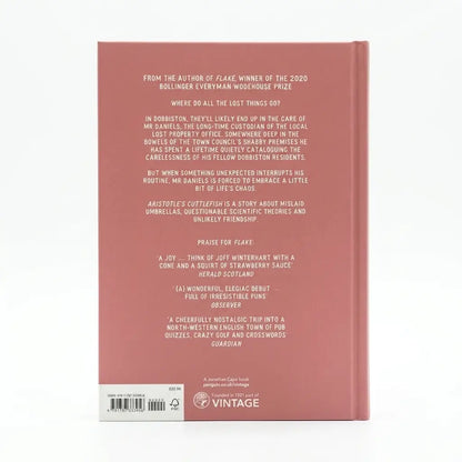 The back cover of a book, shown flat against a white background. The cover is a muted dusty rose pink with white text listing critical acclaim and publisher details, including the Vintage logo at the bottom.