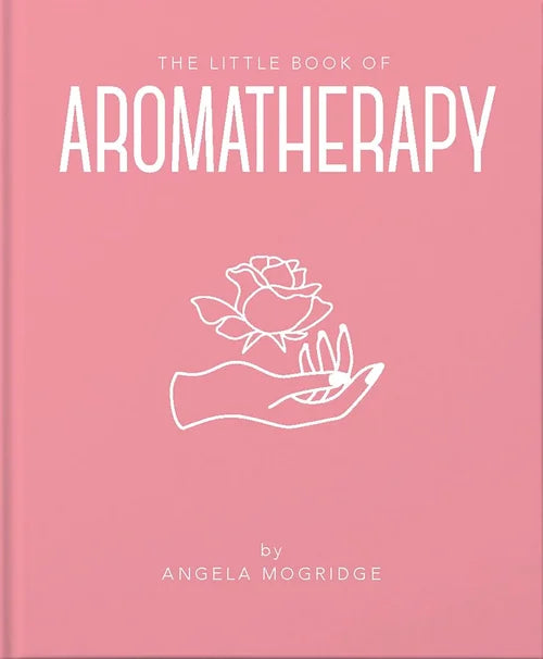 Pink book titled 'The Little Book of Aromatherapy' with a white rose illustration on a pink background