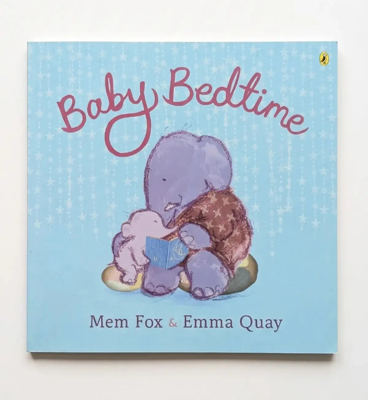 Book cover of 'Baby Bedtime' with illustrations of a purple elephant and two animals on a blue background.