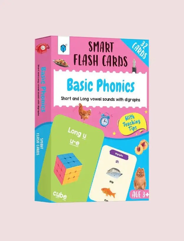 A boxed set of Smart Flash Cards titled 'Basic' shown on a pale pink background. The package is bright pink, blue, and green with illustrations and sample flashcard designs visible on the front.