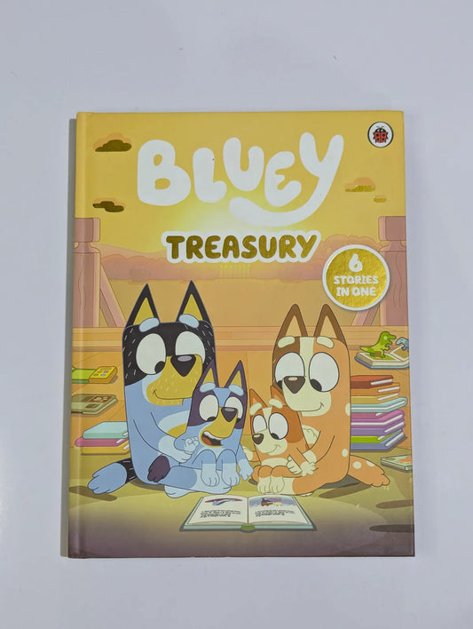 Book titled 'Bluey Treasury' with cartoon characters on a yellow background