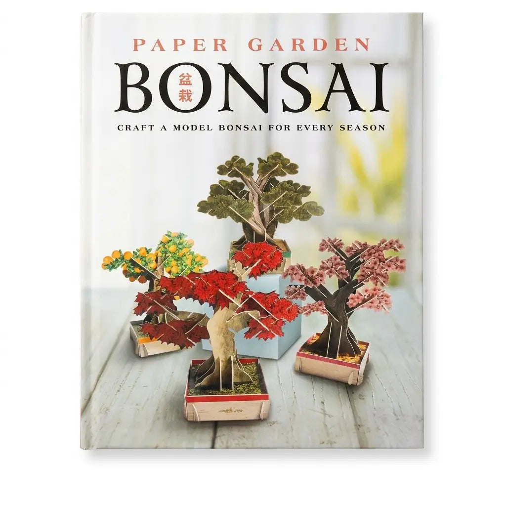 Paper Garden Bonsai book cover featuring four miniature paper bonsai trees in different colors, including red, pink, yellow, and green, arranged on a light wooden surface. The title 'PAPER GARDEN BONSAI' is printed at the top.