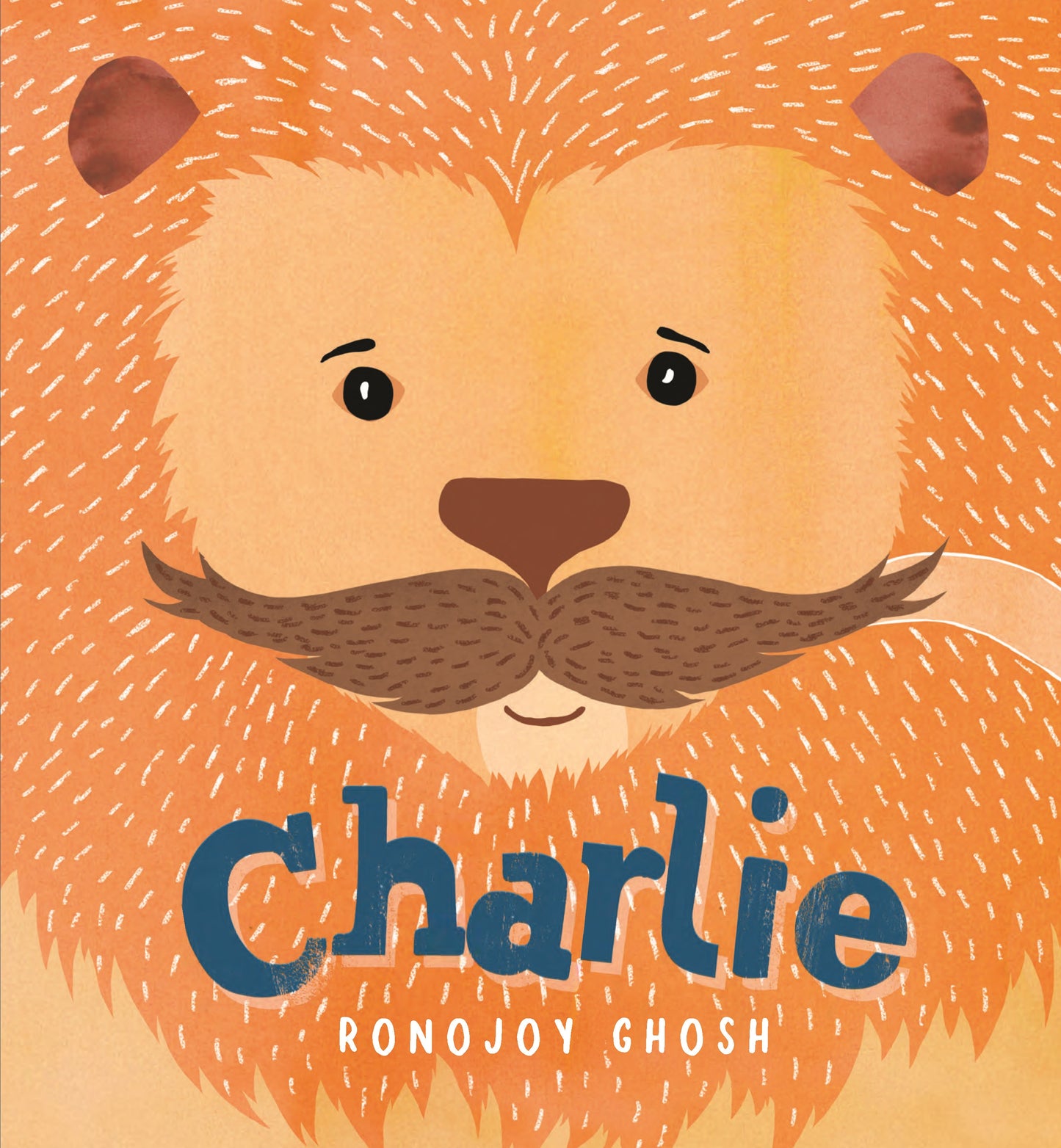 Book cover with a lion's face and the name 'Charlie' on an orange background