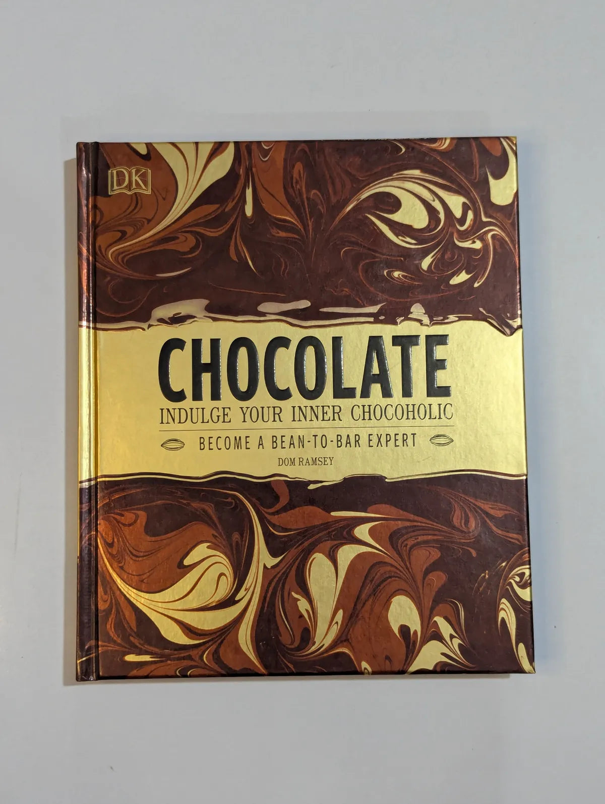 Book titled 'Chocolate' with marbled cover design on a gray background