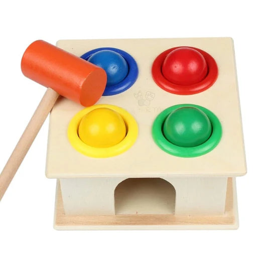 Wooden toy with colorful shapes and a mallet on a white background