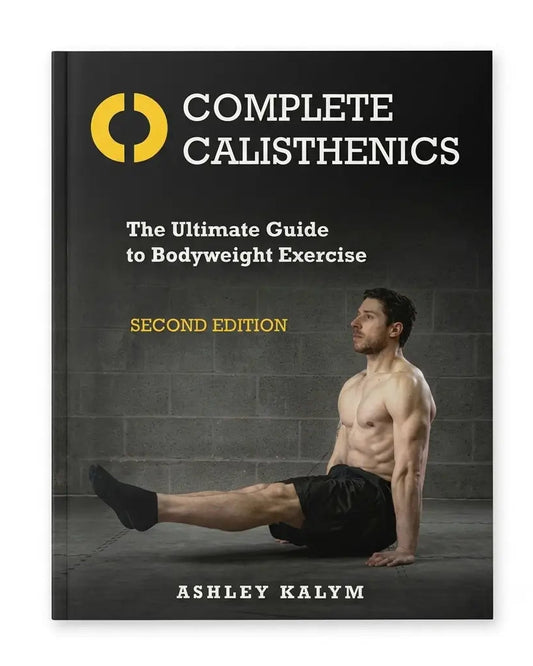 The book cover of 'Complete Calisthenics: The Ultimate Guide to Bodyweight Exercise' by Ashley Kalym, Second Edition. The cover features a dark gray background with a yellow circular logo, white and yellow text, and a photo of a shirtless man performing a bodyweight exercise.