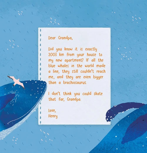 Notebook with a letter on a blue background with whale illustrations