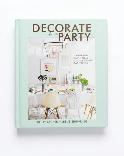 Decorate for Party book by Holly Becker and Leslie Shewring, featuring a mint green cover with a central dining room photograph.