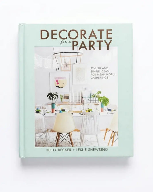 Decorate for Party book by Holly Becker and Leslie Shewring, featuring a mint green cover with a central dining room photograph.