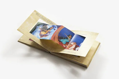Animated book with a scene from 'Aladdin' on a white background