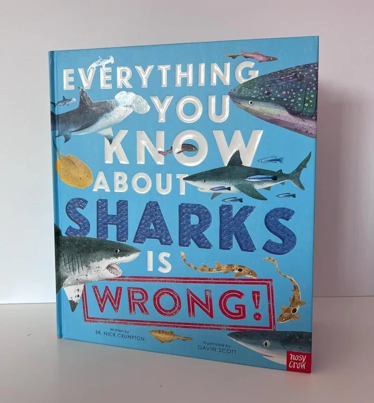 Book titled 'Everything You Know About Sharks Is Wrong' with shark illustrations on a blue background