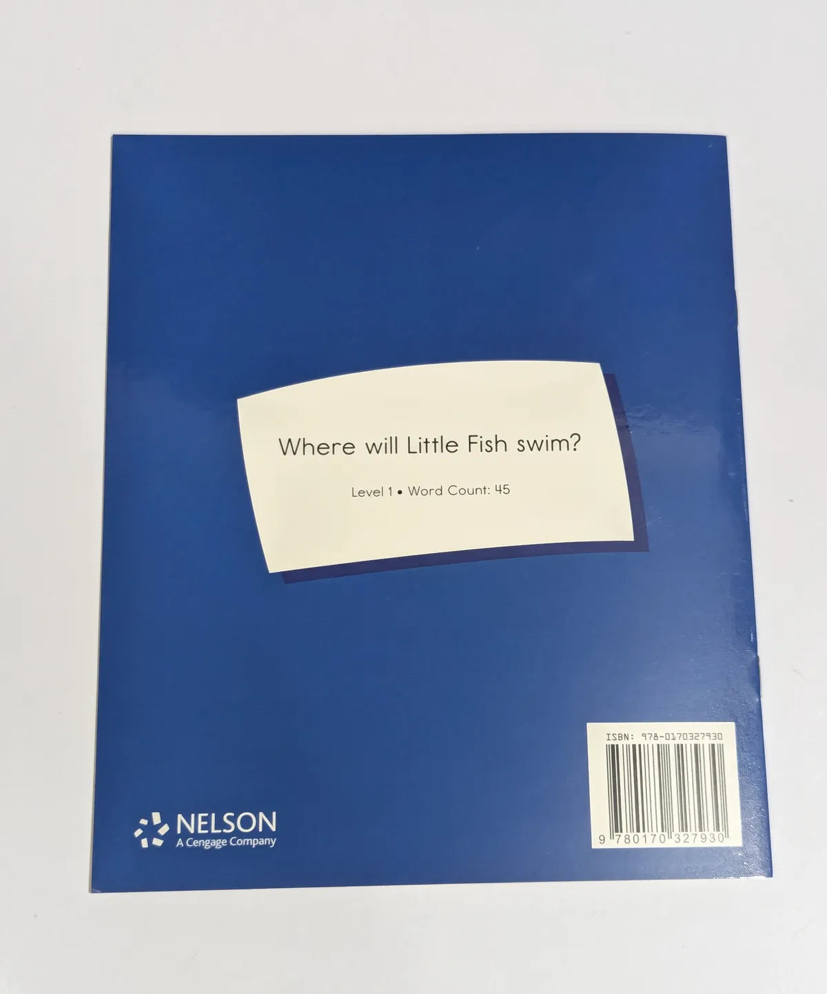 Blue book with a white label on a gray background