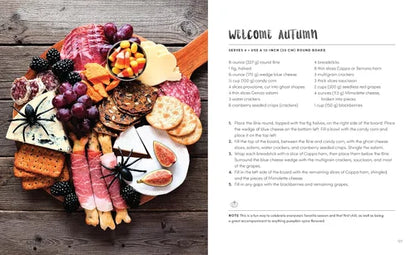 Autumn-themed charcuterie board with text on a wooden surface