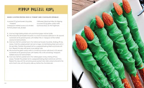 Green-dipped pretzel rods with orange candy tips on a white plate, next to a recipe card.