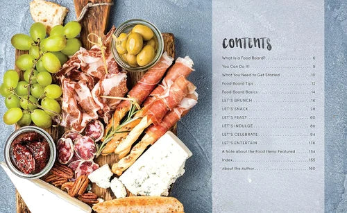 Platter of cured meats, cheeses, and olives with a book titled 'Food Board' on a gray background.