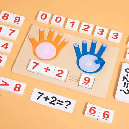 Educational math puzzle with hand-shaped cutouts and number tiles on a yellow background
