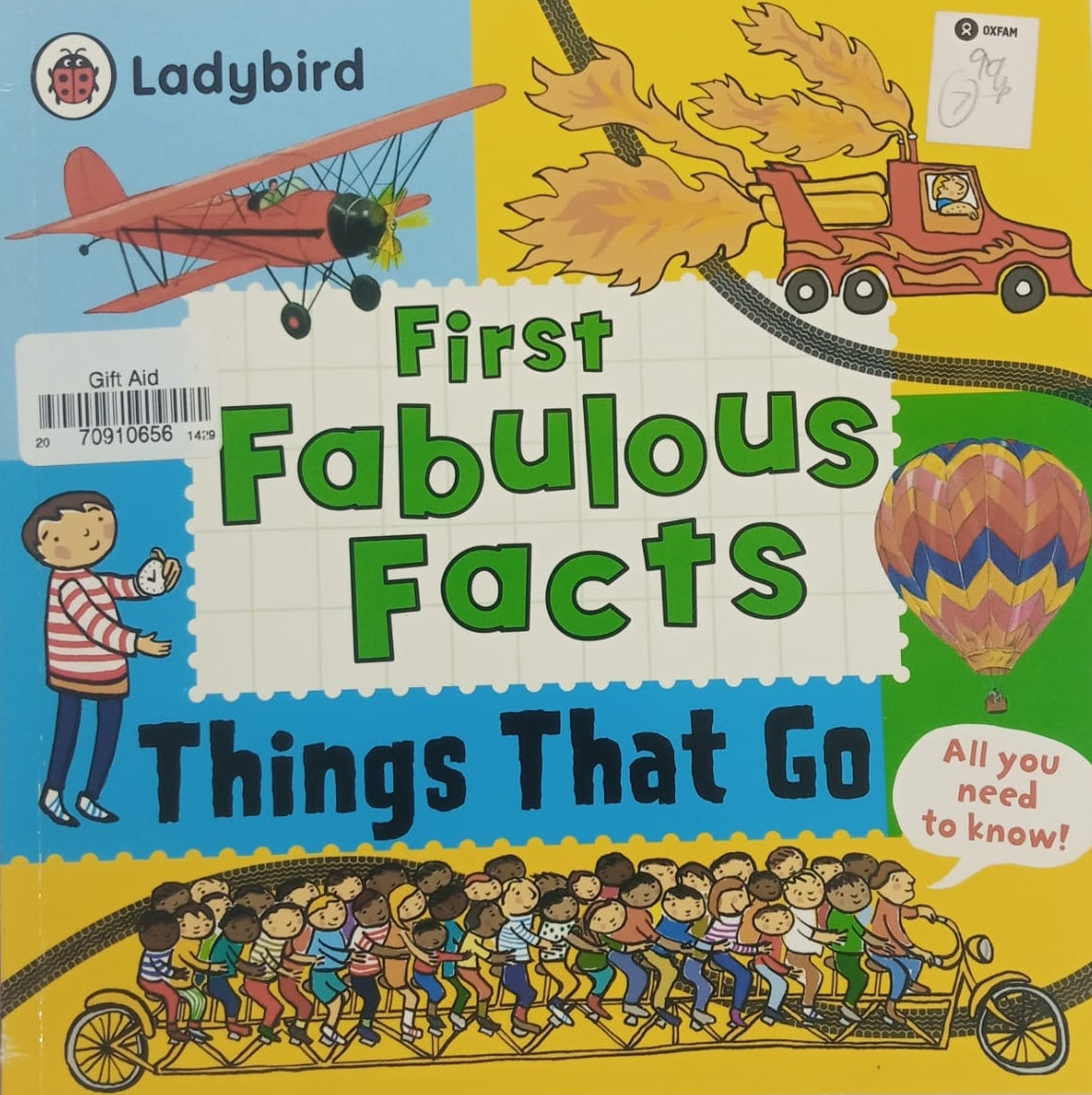 A preloved children's book titled 'First Fabulous Facts Things That Go' with a colorful cover featuring illustrations of vehicles and a character reading a book.