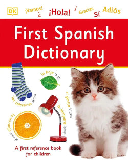 First Spanish Dictionary book cover with a kitten, orange, socks, and lamp illustration on a red background.