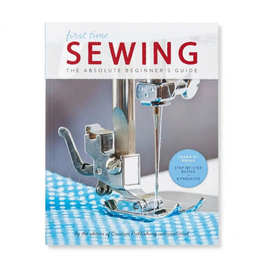 The book cover of 'first time SEWING: THE ABSOLUTE BEGINNER'S GUIDE' by Creative Publishing International, featuring a close-up photo of a sewing machine presser foot on a blue-and-white checkered fabric.