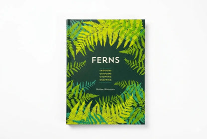 Book cover with fern leaf pattern on a white background