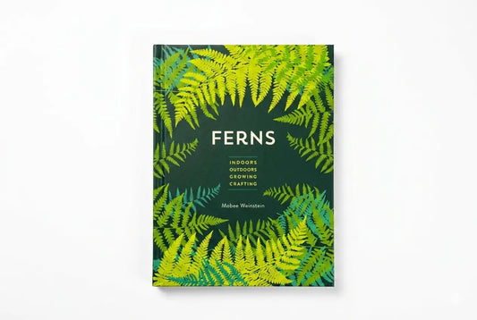 Book cover with fern leaf pattern on a white background