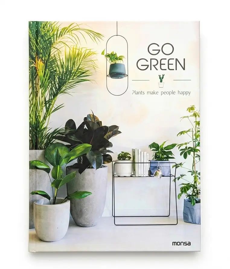 A book titled 'GO GREEN' by Monsa, featuring a cover design with several potted green plants, a hanging planter, and the text 'Plants make people happy'.