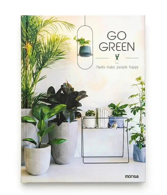 A book titled 'GO GREEN' by Monsa, featuring a cover design with several potted green plants, a hanging planter, and the text 'Plants make people happy'.