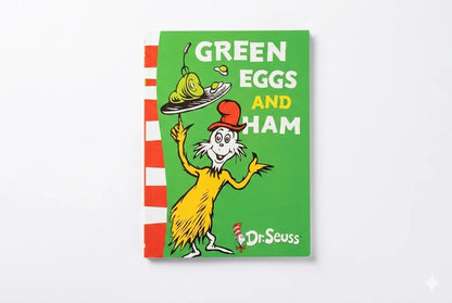 Book cover of 'Green Eggs and Ham' by Dr. Seuss with a green background and character illustration.